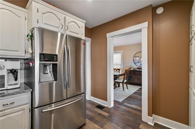 811 Bayridge Ave, Brookline, PA 15226 - kitchen featuring stainless steel fridge, dark wood-style flooring, white cabinetry, and dark stone counters