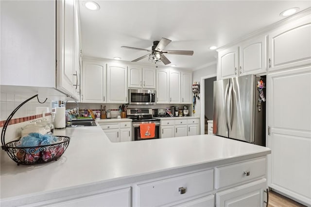 328 Chestnut Dr, Center Twp, PA 16001 - kitchen with stainless steel appliances, ceiling fan, light countertops, recessed lighting, and white cabinetry