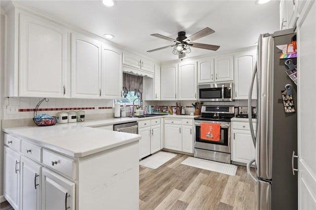 328 Chestnut Dr, Center Twp, PA 16001 - kitchen featuring stainless steel appliances, a peninsula, backsplash, ceiling fan, and recessed lighting