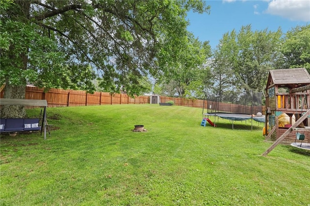 328 Chestnut Dr, Center Twp, PA 16001 - fenced backyard with a trampoline, a playground, and a storage shed