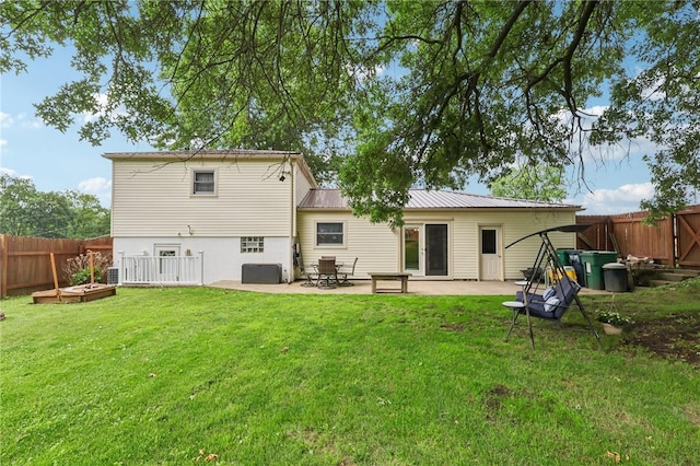 328 Chestnut Dr, Center Twp, PA 16001 - rear view of property featuring a patio area, a fenced backyard, a vegetable garden, and a metal roof