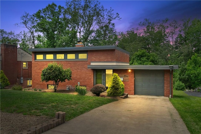 1314 Arrowood Dr, Mt Lebanon, PA 15243 - view of front of property featuring brick siding, an attached garage, driveway, and a front yard