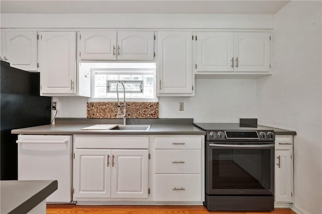 1314 Arrowood Dr, Mt Lebanon, PA 15243 - kitchen with electric range, dishwasher, white cabinetry, and dark countertops