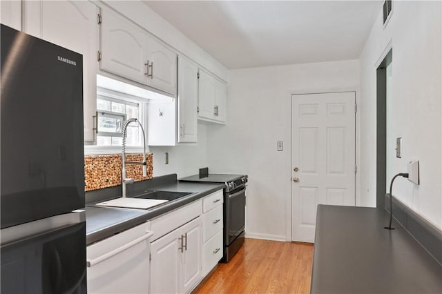 1314 Arrowood Dr, Mt Lebanon, PA 15243 - kitchen featuring refrigerator, dishwasher, dark countertops, black range with electric stovetop, and white cabinetry