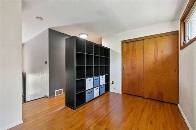 1314 Arrowood Dr, Mt Lebanon, PA 15243 - unfurnished bedroom with wood finished floors and a closet