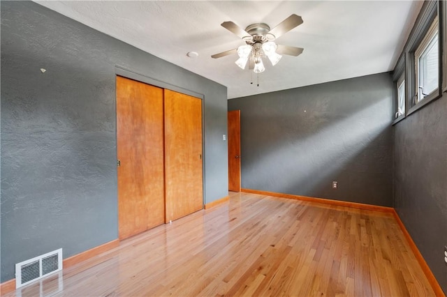 1314 Arrowood Dr, Mt Lebanon, PA 15243 - unfurnished bedroom featuring wood finished floors, a closet, and a ceiling fan