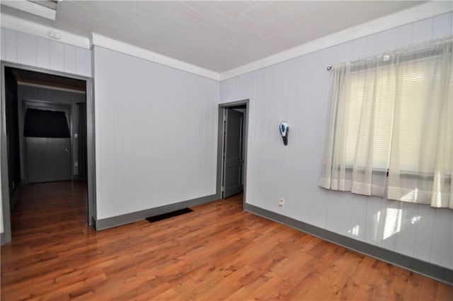 4632 Greensprings Ave, West Mifflin, PA 15122 - empty room featuring wood finished floors and ornamental molding