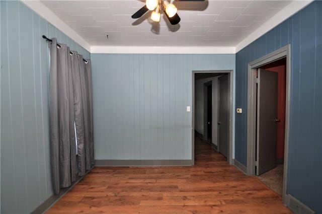 4632 Greensprings Ave, West Mifflin, PA 15122 - spare room featuring wood finished floors, ceiling fan, and wood walls