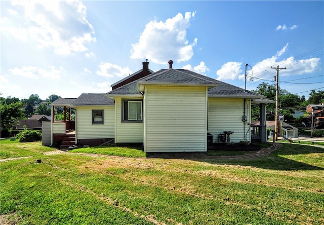 4632 Greensprings Ave, West Mifflin, PA 15122 - rear view of house featuring a yard and roof with shingles