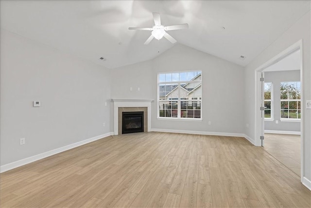 103 Spring Valley Dr, Jackson Twp, PA 16063 - unfurnished living room with plenty of natural light, lofted ceiling, light wood-style flooring, ceiling fan, and a fireplace with flush hearth