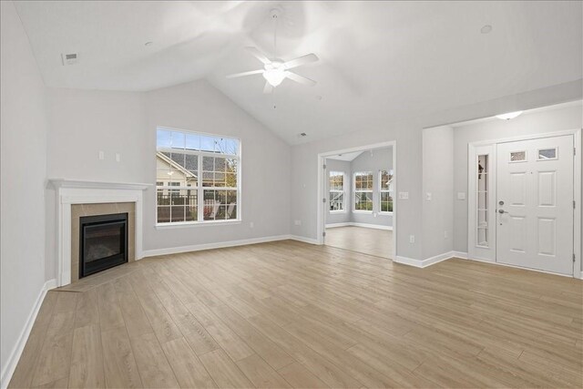103 Spring Valley Dr, Jackson Twp, PA 16063 - unfurnished living room with a ceiling fan, lofted ceiling, light wood finished floors, and a glass covered fireplace