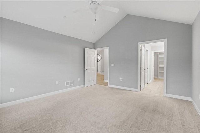 103 Spring Valley Dr, Jackson Twp, PA 16063 - unfurnished bedroom with light colored carpet, a walk in closet, a ceiling fan, and high vaulted ceiling