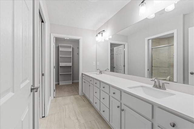 103 Spring Valley Dr, Jackson Twp, PA 16063 - full bathroom with double vanity, a stall shower, a walk in closet, and marble finish floors