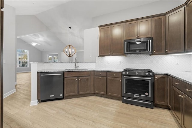 103 Spring Valley Dr, Jackson Twp, PA 16063 - kitchen featuring dishwashing machine, range with gas cooktop, a peninsula, light wood finished floors, and dark brown cabinetry