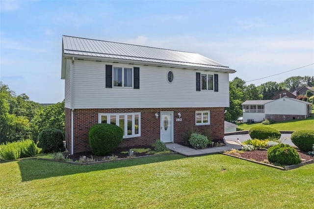 2812 Ridge Road Ext, Economy, PA 15005 - colonial house with a front lawn, brick siding, and a metal roof
