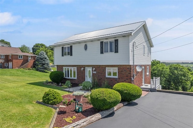 2812 Ridge Road Ext, Economy, PA 15005 - colonial home with brick siding, a front lawn, and a metal roof