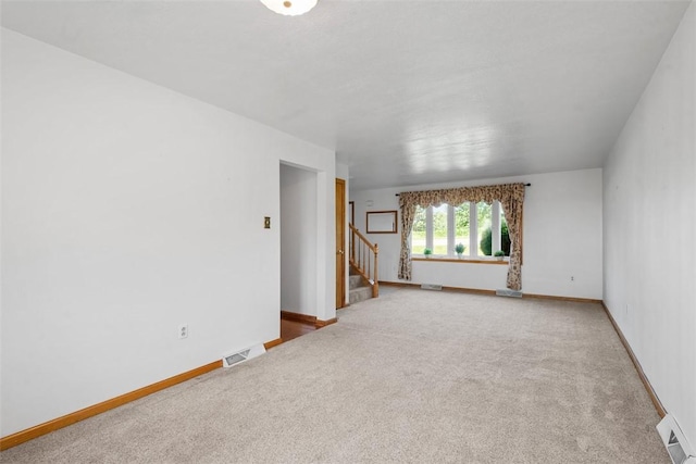 2812 Ridge Road Ext, Economy, PA 15005 - carpeted empty room featuring stairway and baseboards