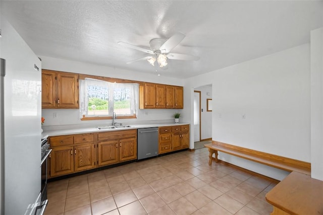 2812 Ridge Road Ext, Economy, PA 15005 - kitchen with stainless steel appliances, a ceiling fan, brown cabinets, and light countertops