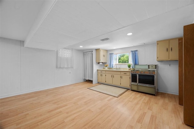 2812 Ridge Road Ext, Economy, PA 15005 - kitchen featuring double oven range, cream cabinets, light wood-style floors, and light countertops