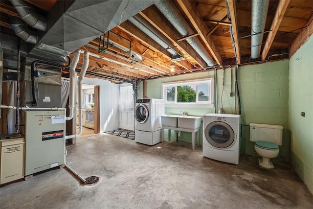 2812 Ridge Road Ext, Economy, PA 15005 - basement featuring independent washer and dryer, concrete block wall, and heating unit