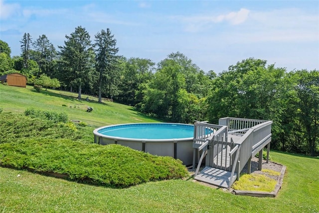 2812 Ridge Road Ext, Economy, PA 15005 - swimming pool with a lawn, a deck, and view of wooded area