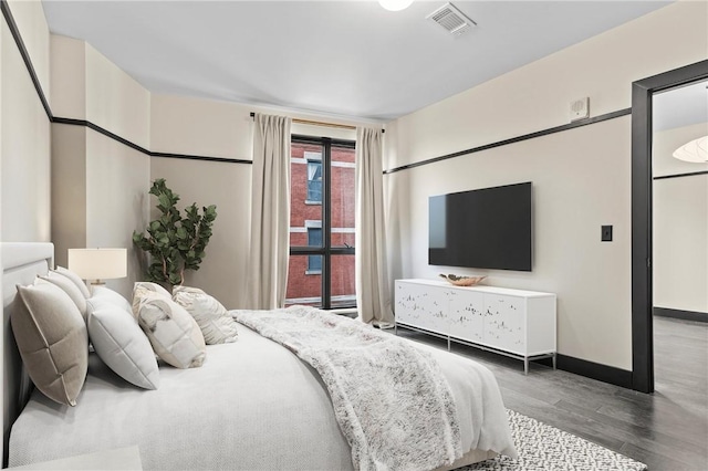 3725 Butler St Unit 306, Lawrenceville, PA 15201 - bedroom with wood finished floors and baseboards