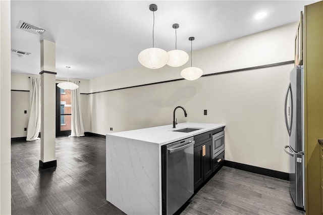 3725 Butler St Unit 306, Lawrenceville, PA 15201 - kitchen featuring appliances with stainless steel finishes, a peninsula, dark wood-style floors, and light countertops