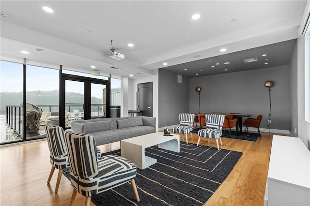 3725 Butler St Unit 306, Lawrenceville, PA 15201 - living room featuring light wood-type flooring and recessed lighting