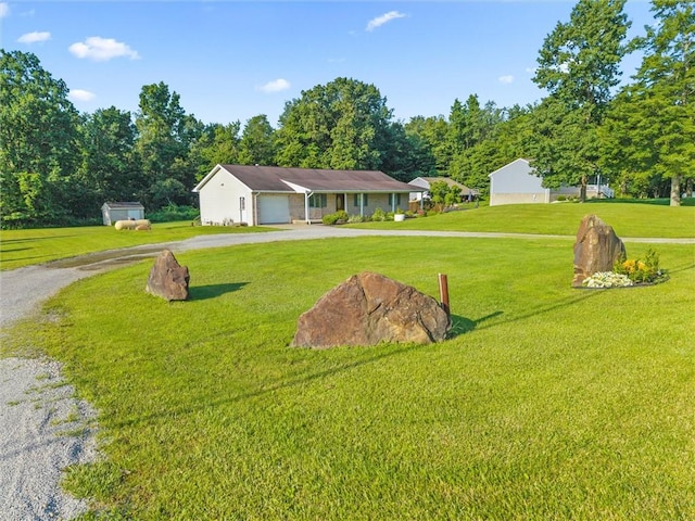 156 Riemer Rd, Buffalo Twp, PA 16055 - view of front facade featuring gravel driveway, an attached garage, and a front yard