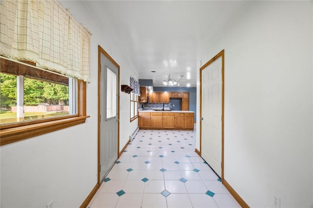 156 Riemer Rd, Buffalo Twp, PA 16055 - hallway with a baseboard radiator, light tile patterned flooring, and a chandelier