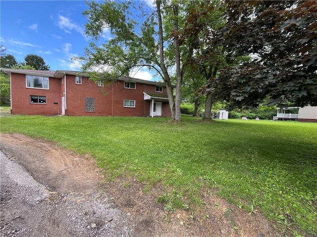 5601 Rodgers St, Lincoln Place, PA 15207 - view of home's exterior with brick siding and a lawn