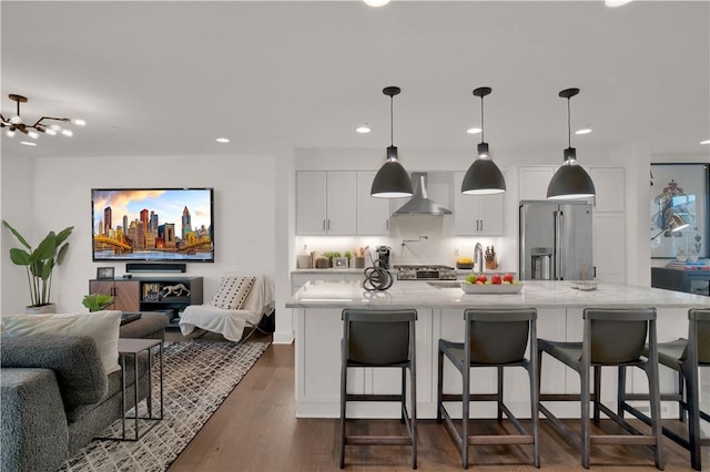 1817 Fox Way S, Side, PA 15203 - kitchen with high end refrigerator, wall chimney exhaust hood, open floor plan, white cabinets, and a kitchen bar