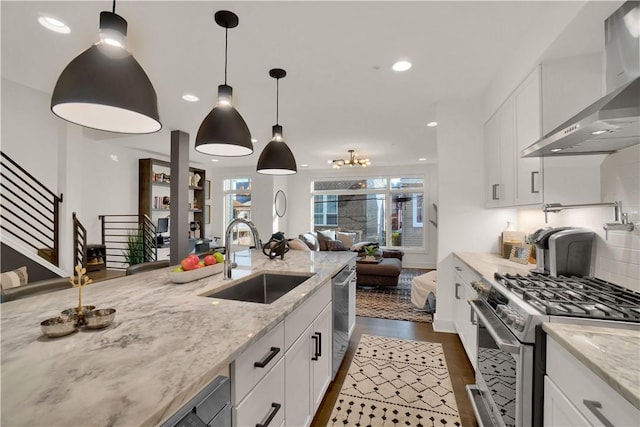 1817 Fox Way S, Side, PA 15203 - kitchen featuring wall chimney exhaust hood, stainless steel appliances, open floor plan, white cabinetry, and light stone countertops
