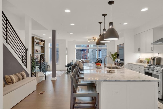 1817 Fox Way S, Side, PA 15203 - kitchen with high end stainless steel range oven, white cabinetry, recessed lighting, light stone countertops, and open floor plan