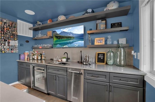 1817 Fox Way S, Side, PA 15203 - indoor wet bar with wine cooler, wood finished floors, and stainless steel dishwasher