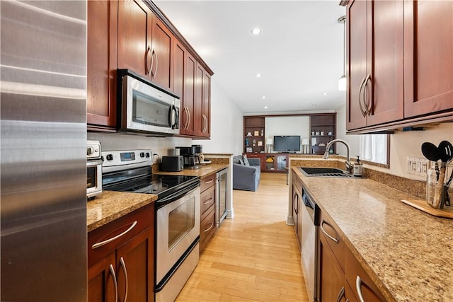 21 Enon Way S, Side, PA 15203 - kitchen featuring stainless steel appliances, light wood finished floors, open floor plan, light stone counters, and recessed lighting