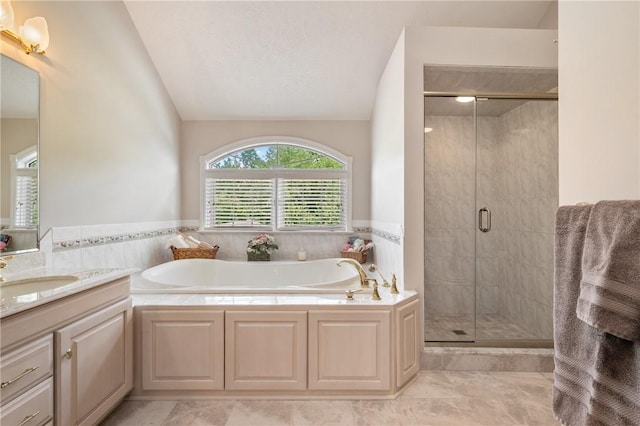 4127 Kellington Ct, Murrysville, PA 15668 - bathroom featuring vanity, lofted ceiling, a bath, and a stall shower