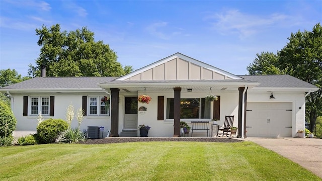 8609 Peters Rd, Cranberry Twp, PA 16066 - view of front of property featuring a porch, an attached garage, a front lawn, driveway, and board and batten siding