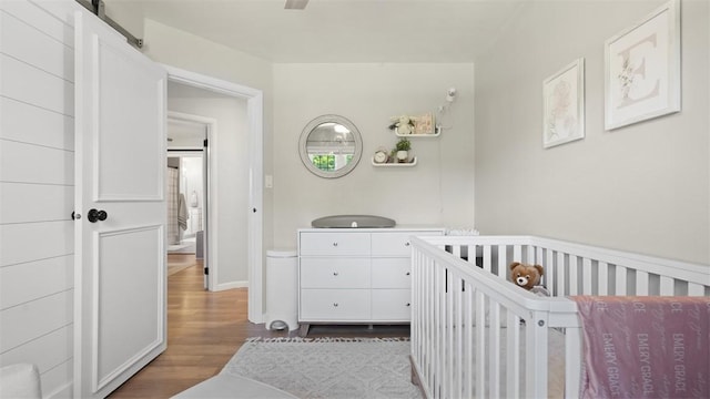 8609 Peters Rd, Cranberry Twp, PA 16066 - bedroom with wood finished floors and a nursery area