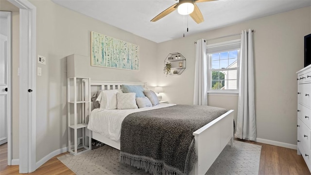 8609 Peters Rd, Cranberry Twp, PA 16066 - bedroom with wood finished floors and a ceiling fan