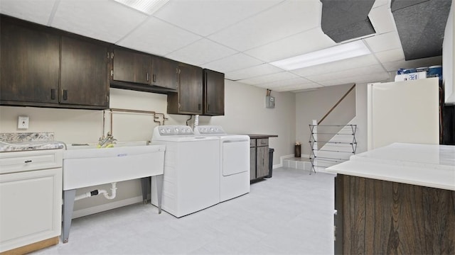 8609 Peters Rd, Cranberry Twp, PA 16066 - laundry area featuring cabinet space, washer and dryer, and light flooring