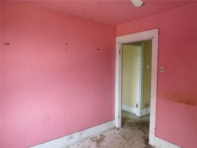 546 Ridge Ave, New Kensington, PA 15068 - empty room featuring concrete flooring and baseboards
