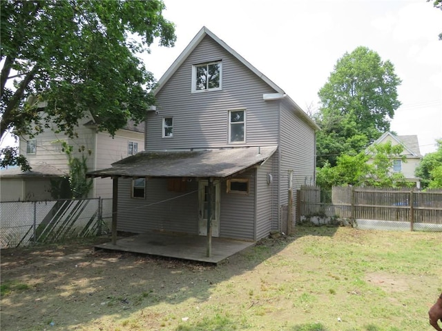546 Ridge Ave, New Kensington, PA 15068 - rear view of property with a fenced backyard and a patio area
