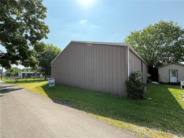 00 Cranberry Ln, Carmichaels/Cumblnd, PA 15320 - view of side of home featuring a yard, an outdoor structure, and board and batten siding