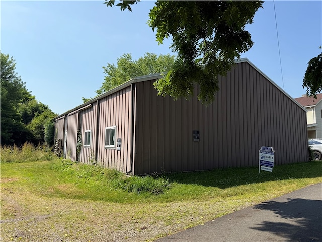 00 Cranberry Ln, Carmichaels/Cumblnd, PA 15320 - view of side of property with a yard, board and batten siding, and an outbuilding