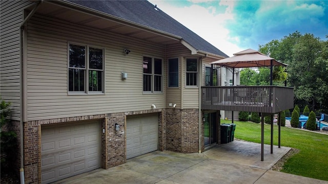121 Covington Dr, Center Twp, PA 16001 - view of property exterior featuring a gazebo, brick siding, an attached garage, a yard, and driveway
