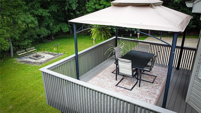 121 Covington Dr, Center Twp, PA 16001 - wooden deck with an outdoor fire pit, a gazebo, a lawn, and outdoor dining space
