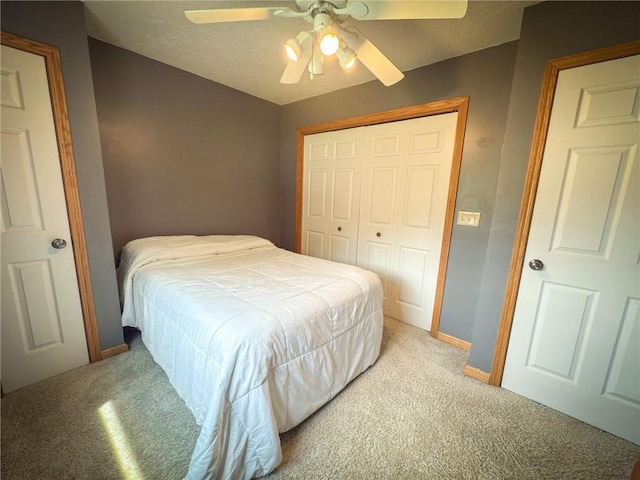 121 Covington Dr, Center Twp, PA 16001 - bedroom with light colored carpet, a closet, ceiling fan, and a textured ceiling