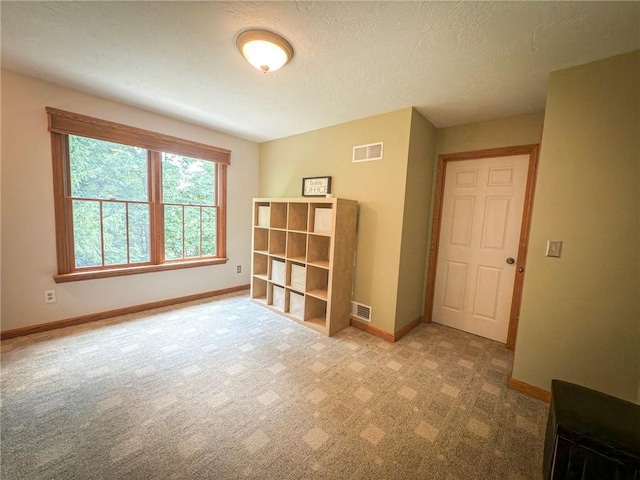121 Covington Dr, Center Twp, PA 16001 - carpeted spare room with baseboards and a textured ceiling