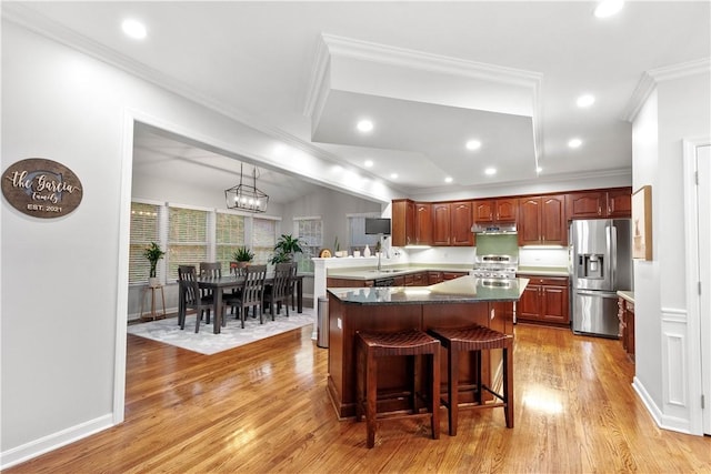 3001 Willowbrook Dr, South Fayette, PA 15017 - kitchen featuring appliances with stainless steel finishes, light wood-type flooring, recessed lighting, under cabinet range hood, and a kitchen breakfast bar